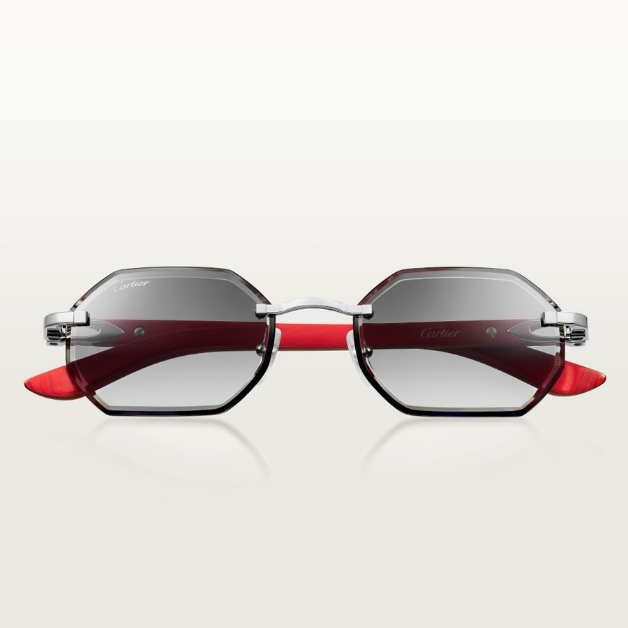 occhiali da sole cartier con design allungato a forma di c.
